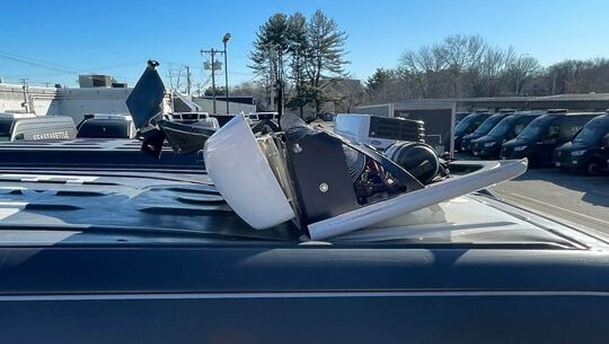 Roof-mounted refrigeration unit opened for repair